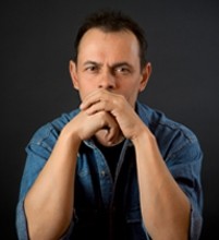 Portrait of the sad man against a dark background